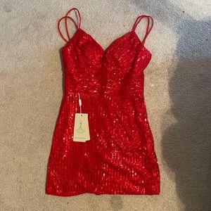 Red homecoming/cocktail dress; tie back; comes with padding; never worn before